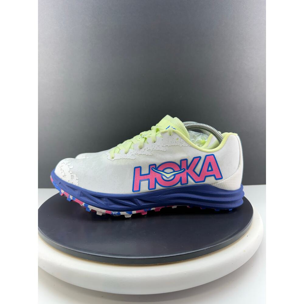 Hoka One One White Athletic Shoe with Blue and Neon Yellow Accents